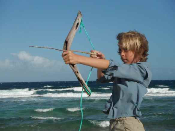 Cole with bow & arrow he made on the beach.