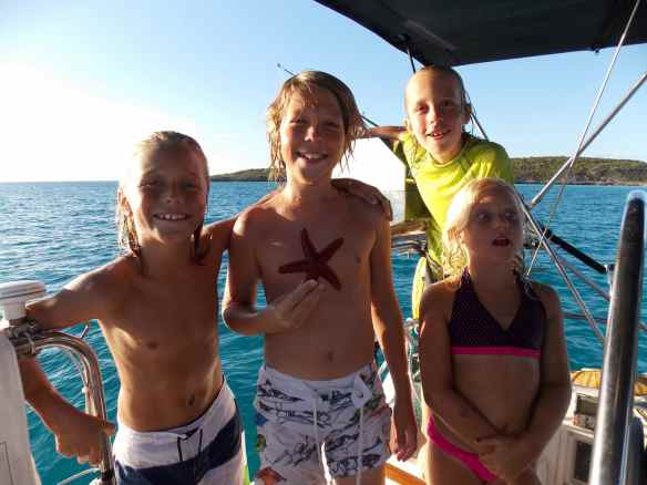 We are all happy that some cruising kids are holed up at Black Point with us. They love to dive off the bow of the boat, swim around to the transom, walk the side decks to the front of the boat and do it all over again and again and again! Happy,tired kids and parents at night.