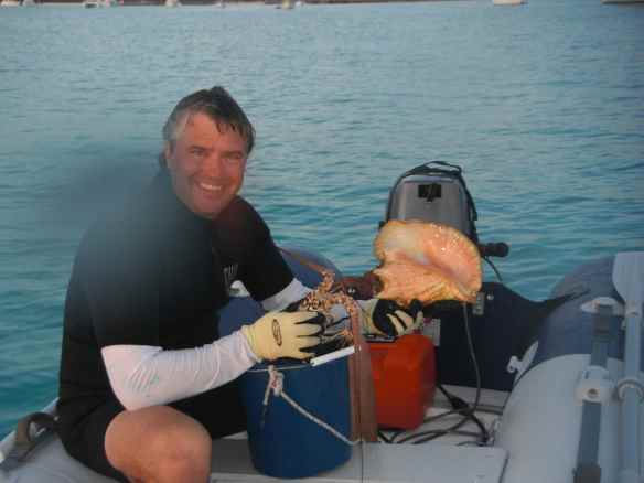 Mark with the catch of the day, 2 lobster and 1 conch.