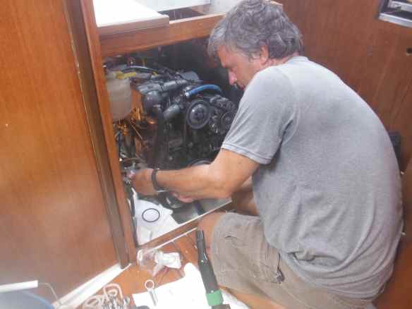 Mark working on the engine.  He loves the 5 sided engine access on Truansea!