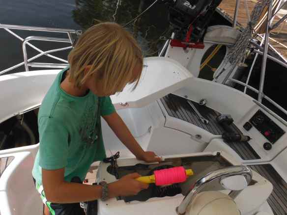 Cole helping with a wiring project on Commotion, a friend's boat in Fort Lauderdale.