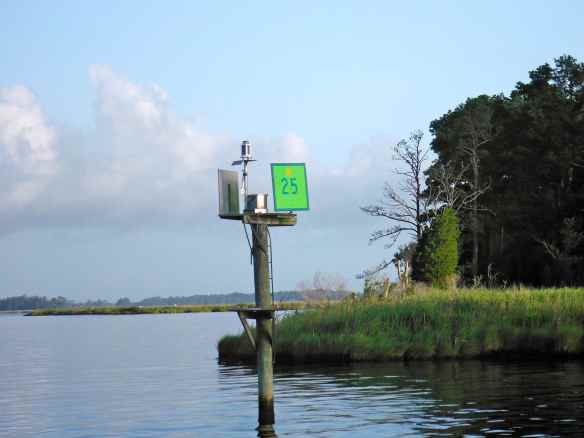 Green, square dayboard marker with yellow triangle ICW.  The yellow triangles are normally on the red triangle markers.